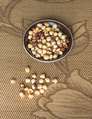 Healthy food  for background image close up hazelnuts.  Nuts texture on top view on the cup plate