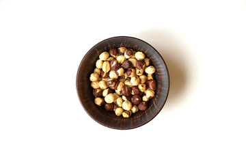 Healthy food  for background image close up hazelnuts.  Nuts texture on white grey table top view on the cup plate