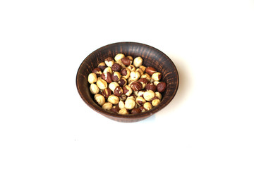 Healthy food  for background image close up hazelnuts.  Nuts texture on white grey table top view on the cup plate