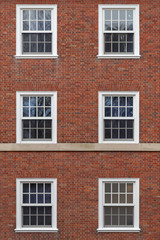 Fototapeta na wymiar college windows on brick wall