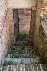 wooden door, entrance to walking paht on city wall of Cittadella, Italy