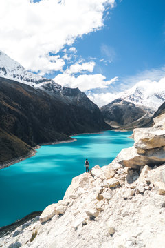 Hiker Beautiful Blue Lake with Snowy Mountains (Lake Paron)