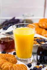 Orange Juice. Continental Breakfast with croissants, cereals and fruits. Selective focus.