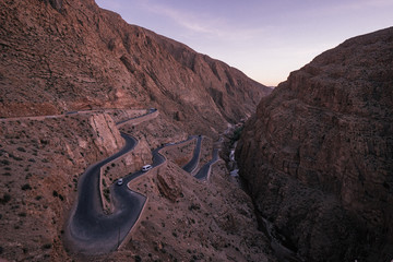 The famous winding road in the Dadestal in Morocco at dusk.