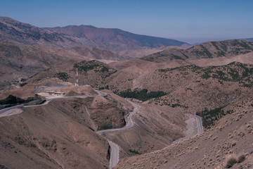 Fototapeta na wymiar A winding road through the atlas mountains in Morocco.