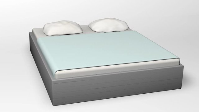 bed with blanket and pillows