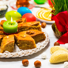 Novruz Ramadan in Azerbaijan. Colored Eggs, Wheat Springs for Easter and Traditional Sweets. Selective focus.