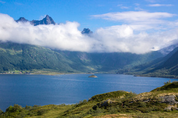 clouds over the mountains above the fjord in Lofoten in Norway