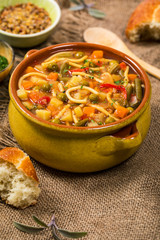Vegetarian Vegetable Soup on Wooden Background. Selective focus.