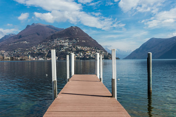 Wooden jetty on Lake Lugano, Ticino canton of Switzerland