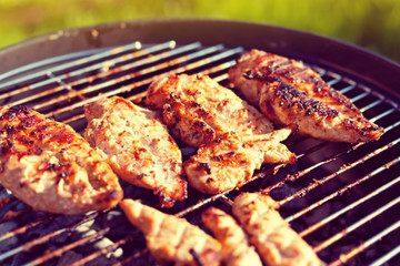 Grilled chicken breast on barbeque