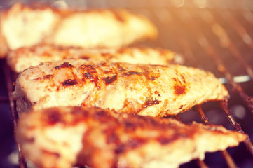 Grilled chicken breast on barbeque