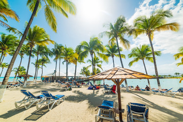 Beach chairs and parasol in Bas Du Fort beach in Guadeloupe