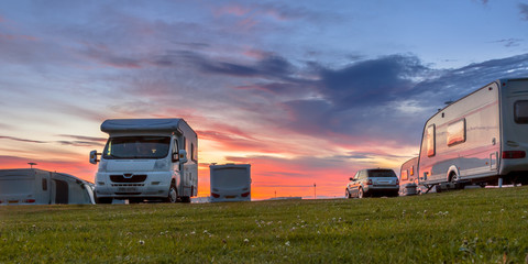 Camping caravans and cars  sunset - obrazy, fototapety, plakaty