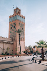 Obraz premium A beautiful designed minaret in the middle of the famous moroccan city Marrakech.