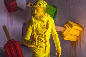 Stylized fantasy actor in scenic make-up and bright colored background.