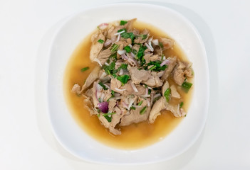 Northeastern Thai spicy pork salad, Nam Tok, popular recipe. Isolated on white