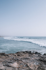 Surfers surfing the Waves of Taghazout at the West Coast of Morocco, Africa