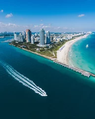 Fototapeten Aerial view of Miami Beach with speedboat in view © manophoto