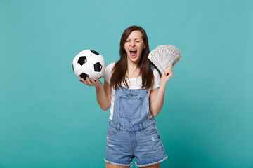 Crazy screaming blinking woman football fan support favorite team with soccer ball, fan of money in...