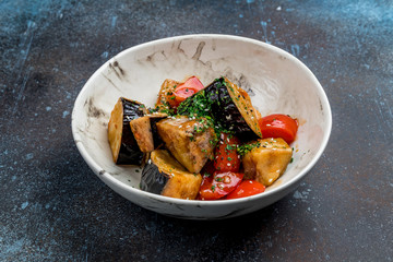 fried eggplant in sweet sour sauce with tomatoes