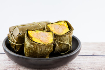 Traditional Colombian tamale as made on Santander region isolated on white background