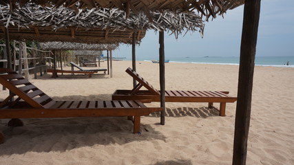 Wooden beach chair on a lonley beach