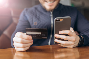 man enters credit card information into the phone