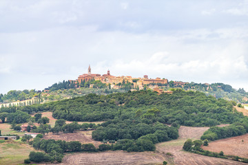 Pienza hilltop town and Italy Val D'Orcia countryside in Tuscany with lake and small village high angle cityscape