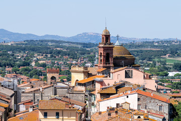 Fototapeta premium Castiglione del Lago, Italy aerial view on Umbria Rocca from Medievale o Rocca del Leone in sunny summer day with cityscape skyline and church bell tower