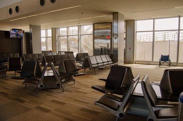 Inside Airport with empty gate and seats