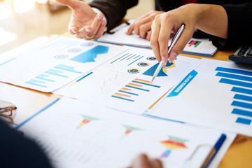 Group of business people discussing project plan together with analyzing data financial report in meeting room. Finance accounting concept.
