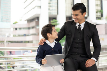 Father single dad playing game smart phone together on business district urban, Dad and Son happy family concept