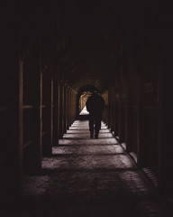 man walking in the tunnel