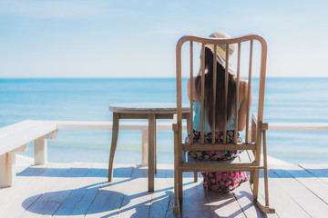 Portrait beautiful young asian woman happy smile relax around beach ocean and sea