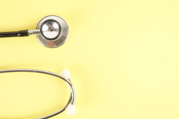 Fototapeta na wymiar Medical Concept with stethoscope ,syringe isolated on yellow background. Copy Space