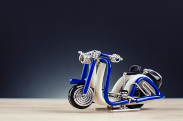 travel concept, miniature handcrafted scooter shot with lighting effect © amirul syaidi