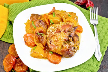 Chicken roast with pumpkin and carrots on green towel