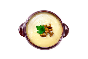 Soup-puree mushroom in clay bowl on top