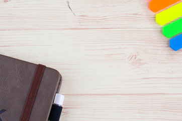 Mockup closed diary with pen on wooden background.selective focus shot,copy space for text.