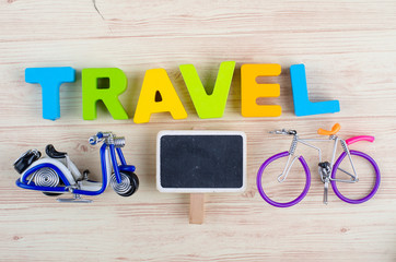 top view vacation and holiday concept word TRAVEL with accessories on wooden background