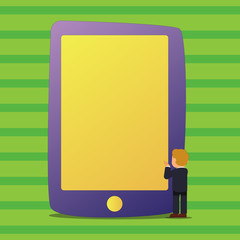 Businessman Standing and Gesturing Facing Blank Screen Giant Tablet Device Design business concept Empty copy text for Web banners promotional material mock up template