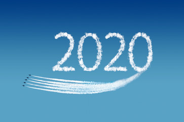 Naklejka na ściany i meble 2020 text, computer graphics, represented by airplane trails. New Year Concept.