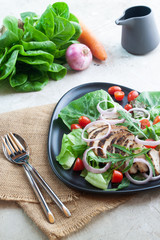 Healthy food, grilled chicken black pepper salad on concrete table. Dieting or kitchen concept