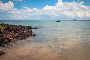 Beach with rocks and boat Espirito Santo Brazil