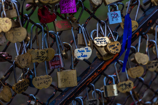 Padlocks on metal fence in Paris