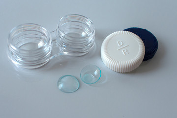 Container for lenses on a white background, lenses for eyes