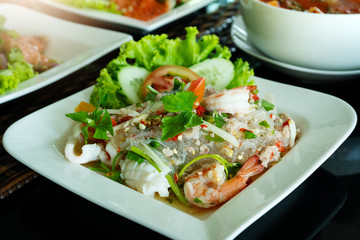 Spicy noodle salad, spicy vermicelli salad with fresh shrimp and squid, Thai food style. Home made food. Concept for a tasty and healthy meal