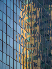 Skyscraper reflections on the windows in