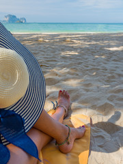 Legs of a woman at the beach